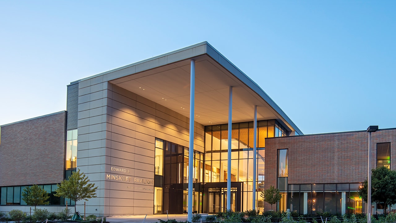 Front, South-facing entrance of the Edward J. Minskoff Pavilion on Michigan State University's campus at dawn.